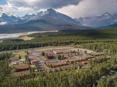 an aerial view of a resort in the mountains at The Crossing in Saskatchewan River Crossing