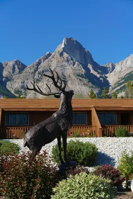 a statue of a deer in front of a building at The Crossing in Saskatchewan River Crossing