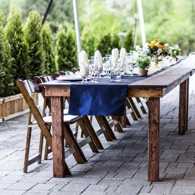 a wooden table with a blue table cloth on it at Executive Suites Hotel and Resort, Squamish in Squamish