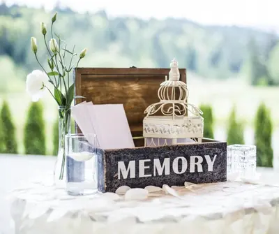 amemory table with a memory box on a table with flowers at Executive Suites Hotel and Resort, Squamish in Squamish