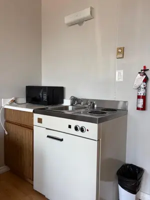 a kitchen with a sink and a stove at Island View Lodge in Powell River