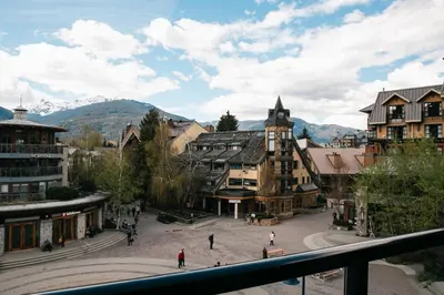 a view of a town with mountains in the background at Carleton Lodge in Whistler