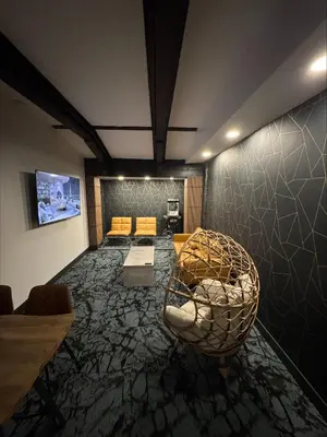 a living room with a couch and a table at Waterways, A Boutique Hotel in Powell River