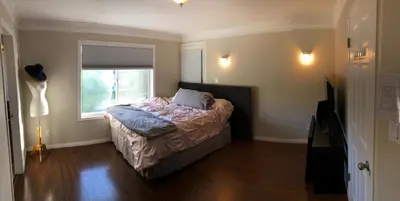 a bedroom with a bed and a window at Royalty B&B in Richmond