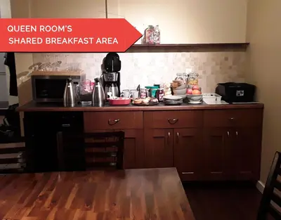 a kitchen with a table and a counter top at Kimberley Downtown Accommodation in Kimberley