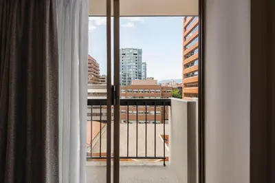 a view of a city from a hotel room window at Holiday Inn & Suites Vancouver Downtown by IHG in Vancouver