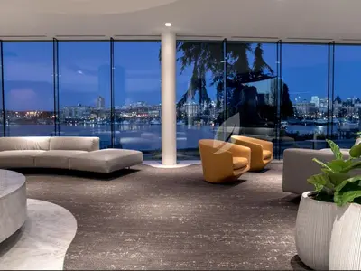 a living room with couches and chairs in a building at Inn at Laurel Point in Victoria