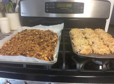 two trays of food sitting on top of an oven at Berkie’s Bed & Breakfast in Port Alberni