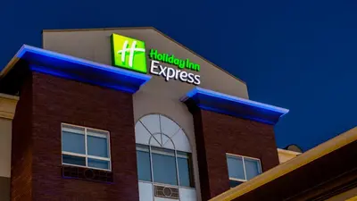 a hampton inn express building with a sign on it at Holiday Inn Express Airdrie by IHG in Airdrie