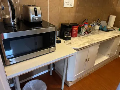 a microwave sitting on a counter in a kitchen at Vancouver shaughnessy guest home in Vancouver