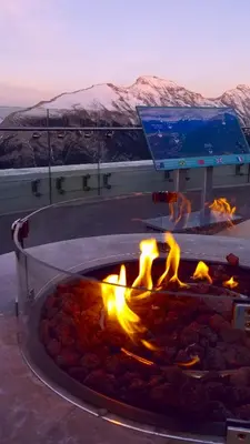 a fire pit in the middle of the desert at Downtown Loft, Mountain Views, Fireplace, Couple's Retreat, Walker's Paradise in Canmore