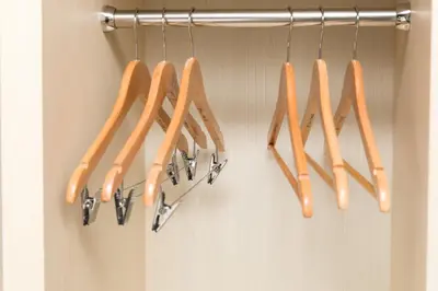 a bunch of utensils are hanging on a rack at Days Inn by Wyndham Chetwynd in Chetwynd