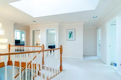 a white staircase in a home with a white ceiling at 3 Private, spacious, bright rooms in a Gorgeous house in New Westminster