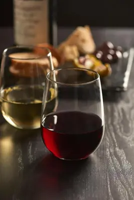 two glasses of wine sitting on a table at Hyatt Place Calgary Airport in Calgary
