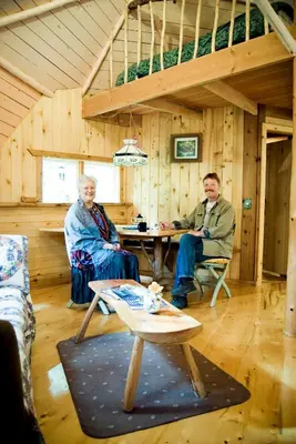 three people sitting in a room with a table at The Magical Dome in Lund