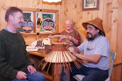 a group of people sitting around a table making a vase at The Magical Dome in Lund