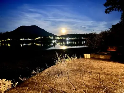 a view of a body of water at night at Waterfront Private Room With Hot Tub & Firepit in Ucluelet