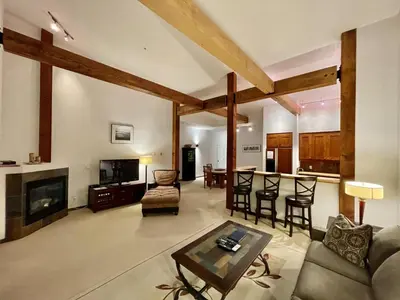 a living room with a couch and a table at Top-Floor Villa With Pacific Ocean Views Bbv in Ucluelet