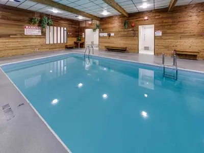 a swimming pool with blue water in a building at Heritage Inn Hotel & Convention Centre - Cranbrook in Cranbrook