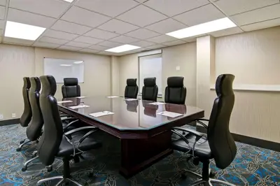 a conference room with a long table and chairs at Hampton Inn & Suites by Hilton Calgary-Airport in Calgary