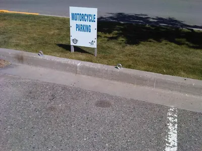 a sign on the side of a road with a parking sign at Accent Inns Kamloops in Kamloops