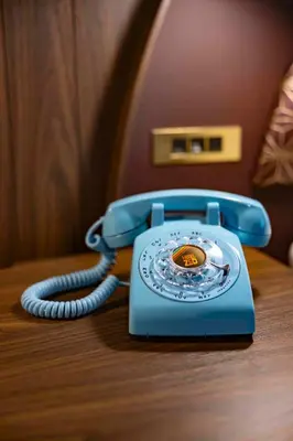 a blue phone sitting on top of a table at Hotel Zed Victoria in Victoria