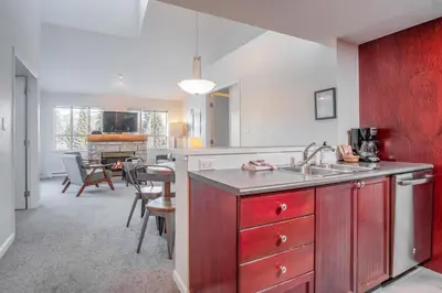 a kitchen with a sink and a counter top at Tyndall Stone by Outpost Whistler in Whistler