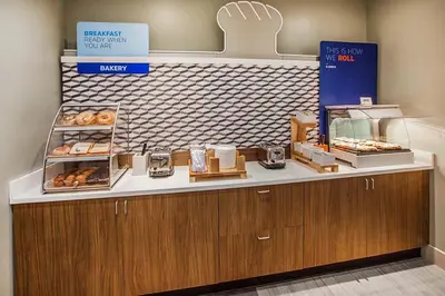 a bakery with a counter with donuts on it at Holiday Inn Express Kamloops by IHG in Kamloops