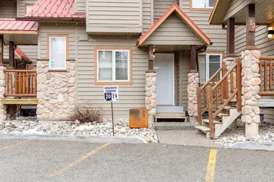 a house with a speed limit sign in front of it at Ski In & 15 Minute Walk to the Lifts Hot Tub AC Pet Friendly in Fernie