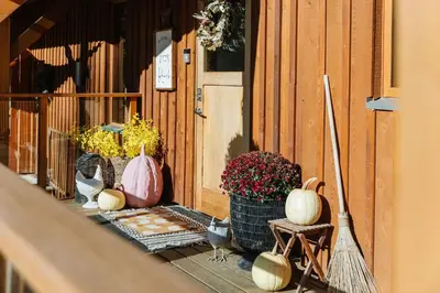 a group of pumpkins sitting on the porch of a house at Myra Canyon Guest Ranch in Kelowna