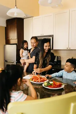 a group of people in a kitchen with plates of food at Summerland Waterfront Resort & Spa in Summerland