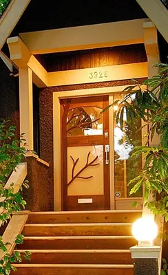 a front door of a building with stairs leading to it at House On Dunbar B&B in Vancouver