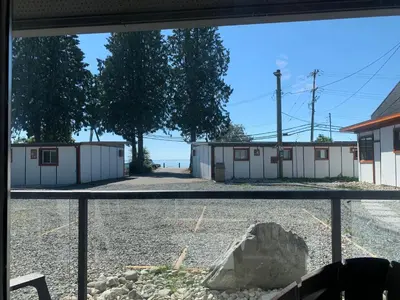 a view from a window of a row of buildings at Oceanside Villas in Sechelt