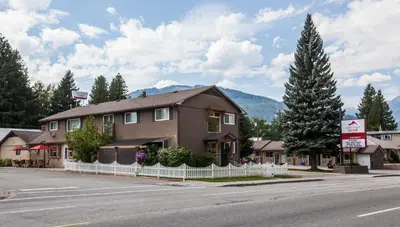 a building on the side of a street at Swiss Chalet Motel in Revelstoke
