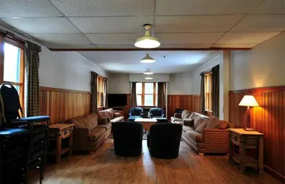 a living room with a couch and a table at Manning Park Resort in Manning Park