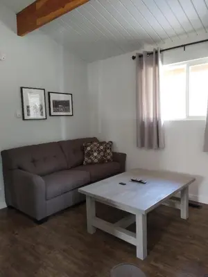 a living room with a couch and a coffee table at Manning Park Resort in Manning Park