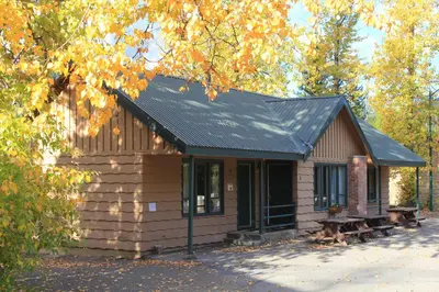 a small cabin with a black roof at Manning Park Resort in Manning Park