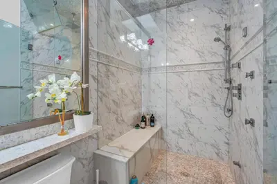 a bathroom with a shower and a toilet and a sink at Vancouver West Cozy Retreat by Host Launch in Vancouver