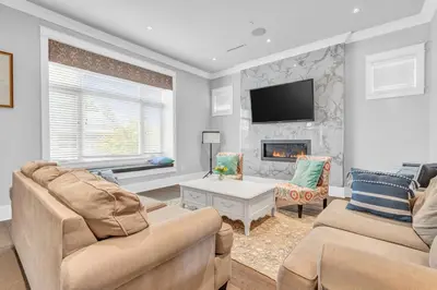 a living room with two couches and a fireplace at Vancouver West Cozy Retreat by Host Launch in Vancouver