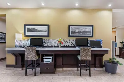 an office with a large desk with three chairs at Best Western Pacific Inn in Vernon