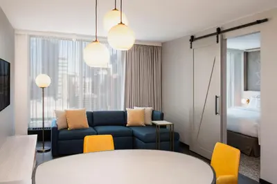 a living room with a couch and a table at Residence Inn by Marriott Calgary Downtown/Beltline District in Calgary