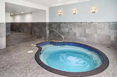 a jacuzzi tub in a hotel room at Best Western Plus Pitt Meadows Inn & Suites in Pitt Meadows