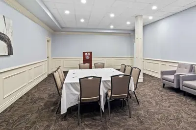 a conference room with a table and chairs at Best Western Plus Pitt Meadows Inn & Suites in Pitt Meadows