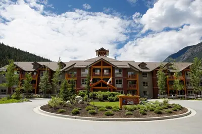 a large building with a sign in front of it at Pemberton Valley Lodge in Pemberton