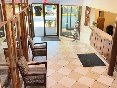a lobby of a store with chairs and a floor at Sunshine Lodge Inn in Gibsons