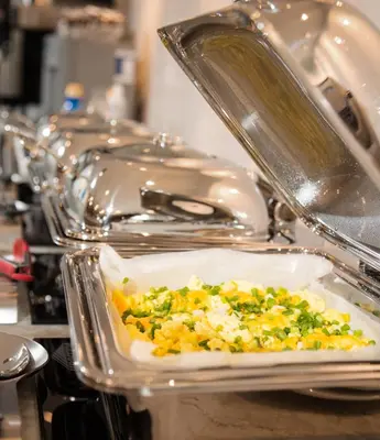 a plate of food sitting in a sink at Pomeroy Hotel Fort McMurray in Fort McMurray