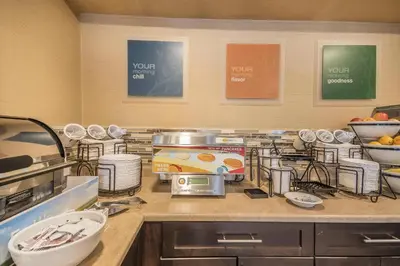 a kitchen with a counter top with a counter top at Comfort Inn in Chilliwack