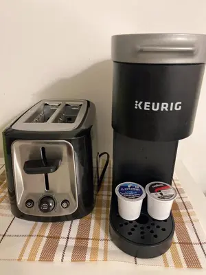 a coffee maker and a toaster sitting on a table at Slumber Lodge in Hope