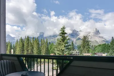 a balcony with a view of a mountain at The Drake Inn in Canmore