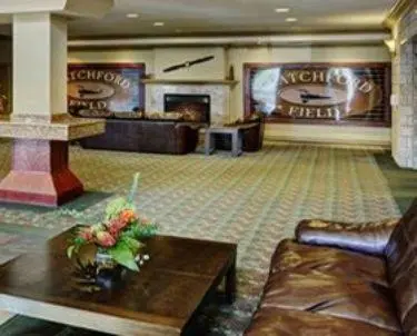 a living room with a couch and a coffee table at Chateau Nova Kingsway in Edmonton